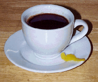 demitasse cup of espresso with lemon peel