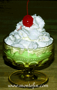 photo of montefin's low carb Mint Pistachio Pudding with Whipped Cream and a glistening red Maraschino Cherry on Top