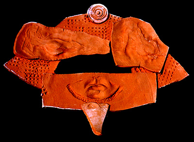 Terracota mirror frame with an ancient Eygptian theme.