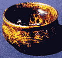 Raku bowl with blood orange glaze.
