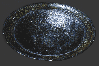 Raku Bowl with mottled metalic finish.