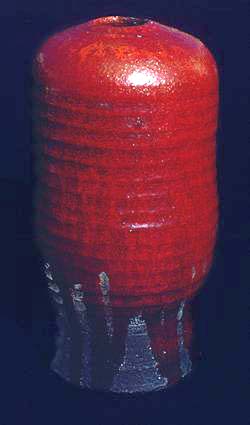 Raku urn with red lead glaze
