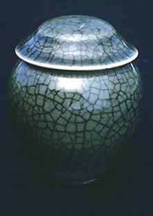 Porcelain ginger jar with celadon glaze and black crackle