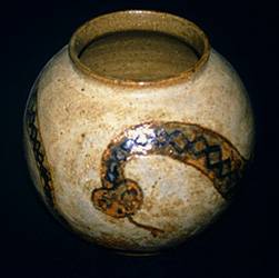 Wheel thrown stoneware pot with southwestern motif and Mojave rattlesnake design.